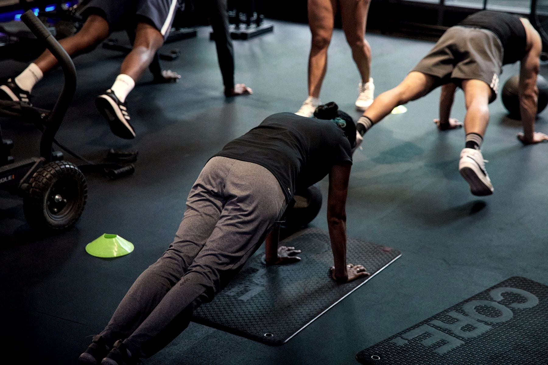 Members working through a coached group circuit on the Rumble Dalston floor